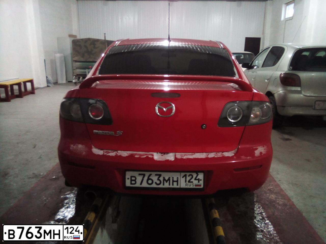 Фото автомобиля MAZDA 3, 2007 — госномер О557ОО13. Цвет: Красный