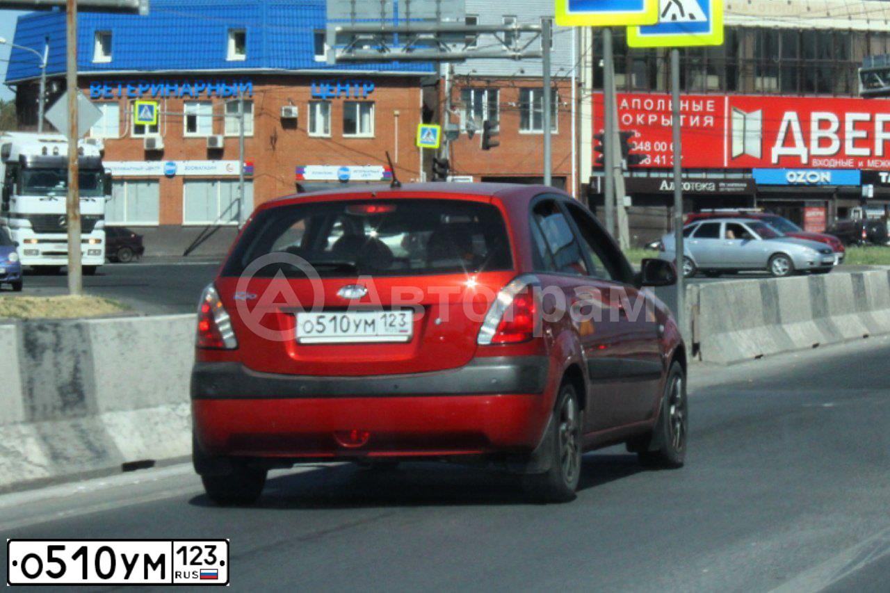 Фото автомобиля KIA RIO, 2009 — госномер М591ЕХ761. Цвет: Красный