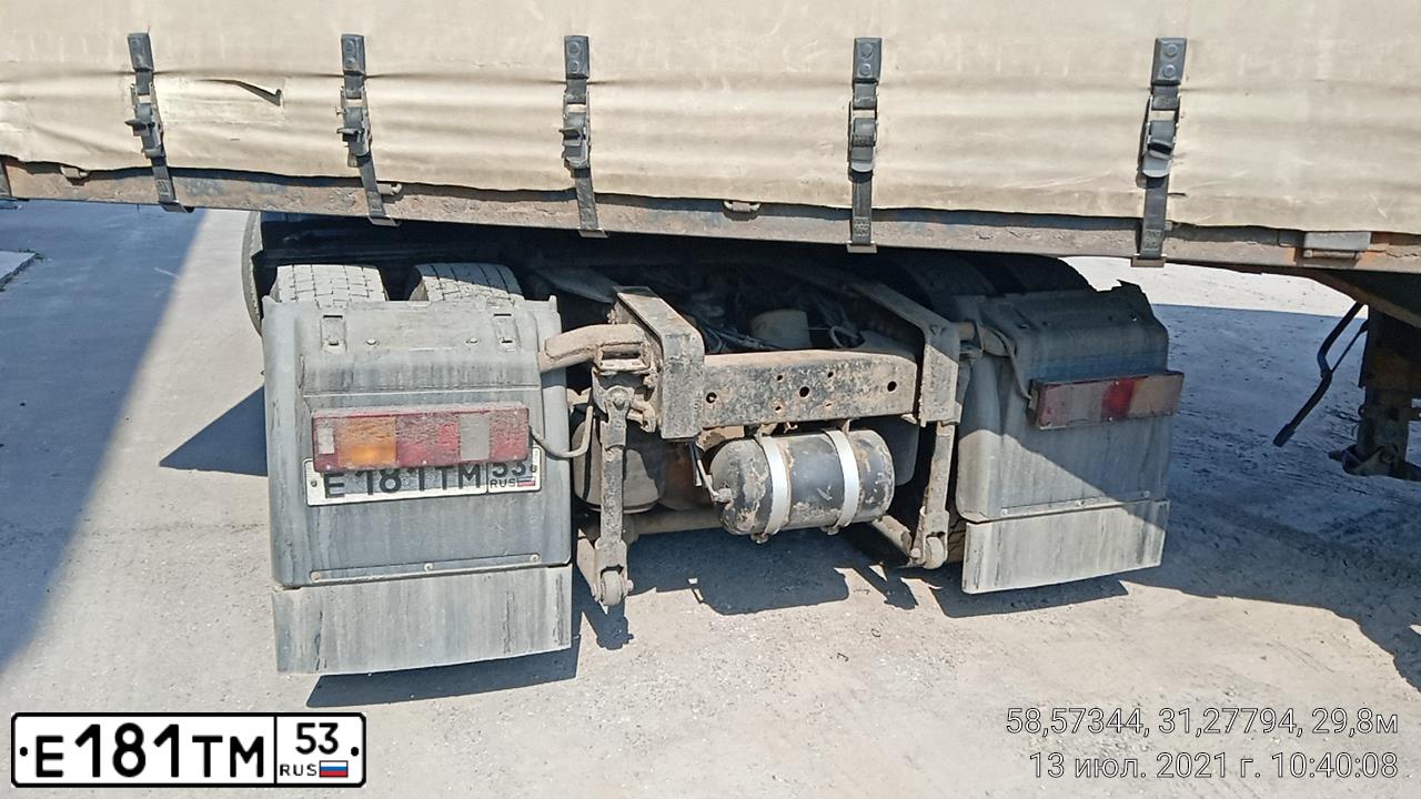 Фото автомобиля MAN TGA, 1998 — госномер Е181ТМ53. Цвет: Красный