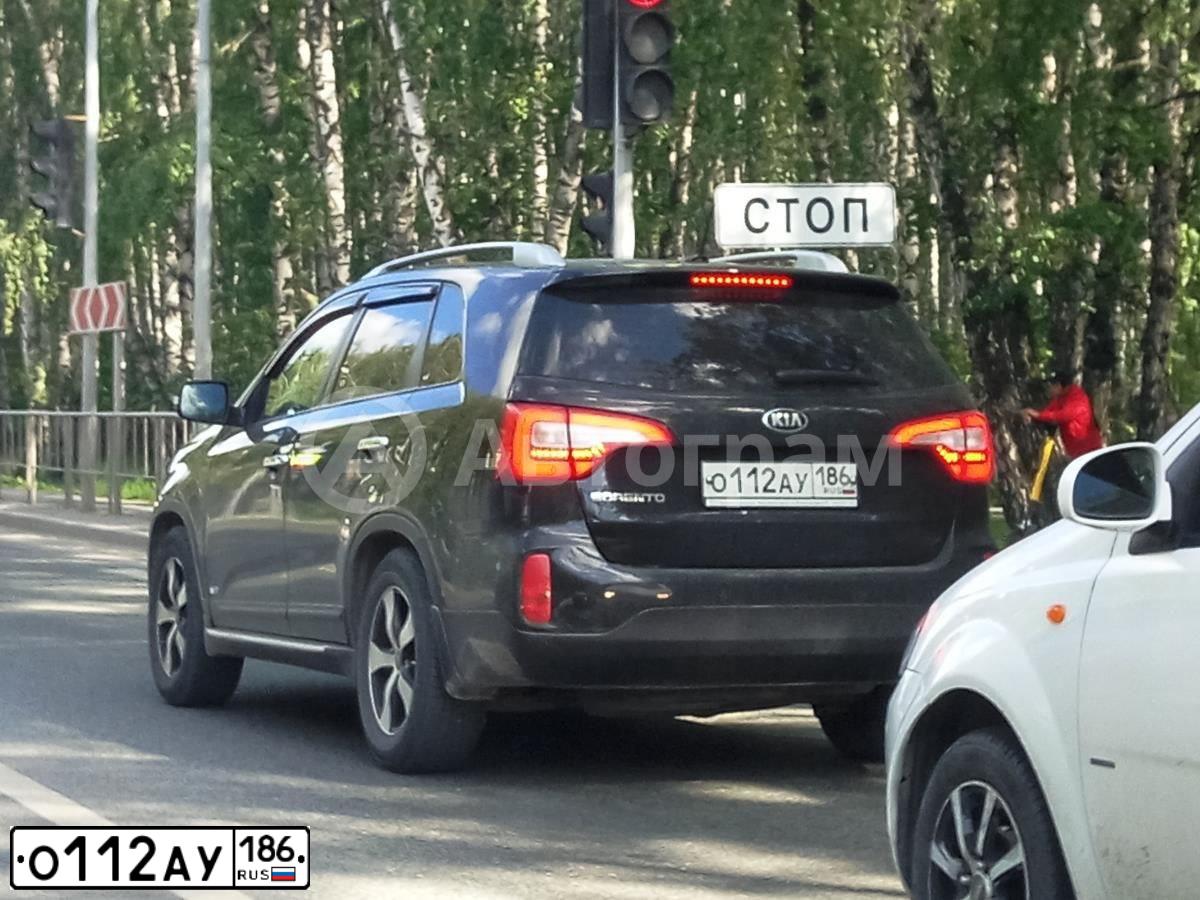 Фото автомобиля KIA SORENTO, 2014 — госномер О112АУ186. Цвет: ЧЕРНЫЙ
