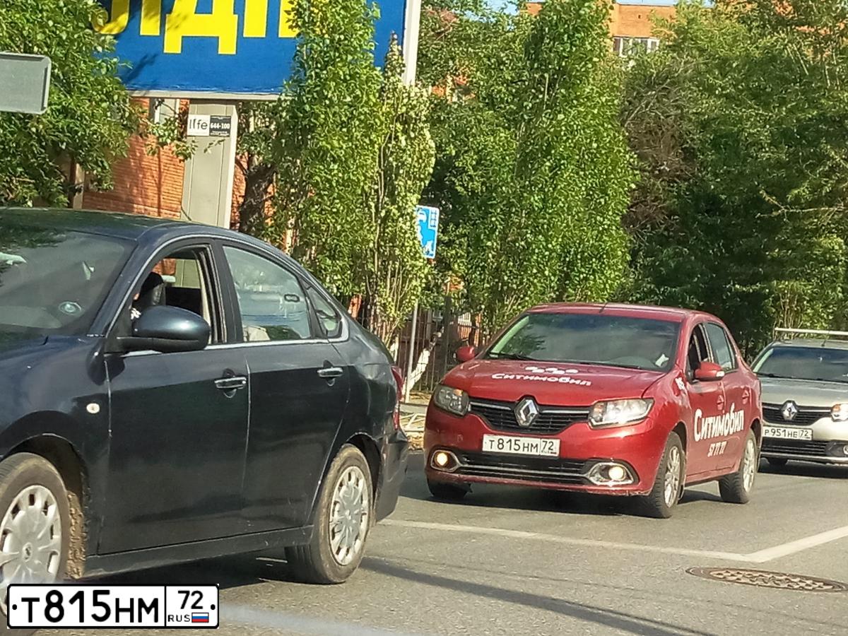 Фото автомобиля RENAULT LOGAN, 2014 — госномер Т815НМ72. Цвет: Красный