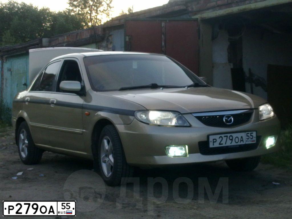 Фото автомобиля MAZDA A 323, 2002 — госномер Р279ОА55. Цвет: БЕЖЕВЫЙ