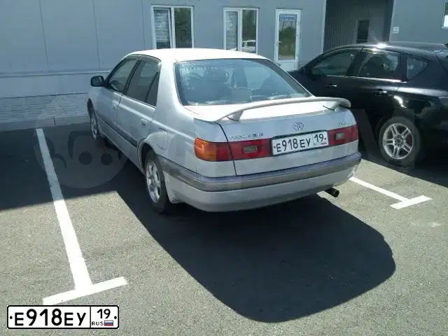Фото автомобиля FAW BESTURN B50, 2012 — госномер Е918ЕУ19. Цвет: СЕРЕБРИСТЫЙ