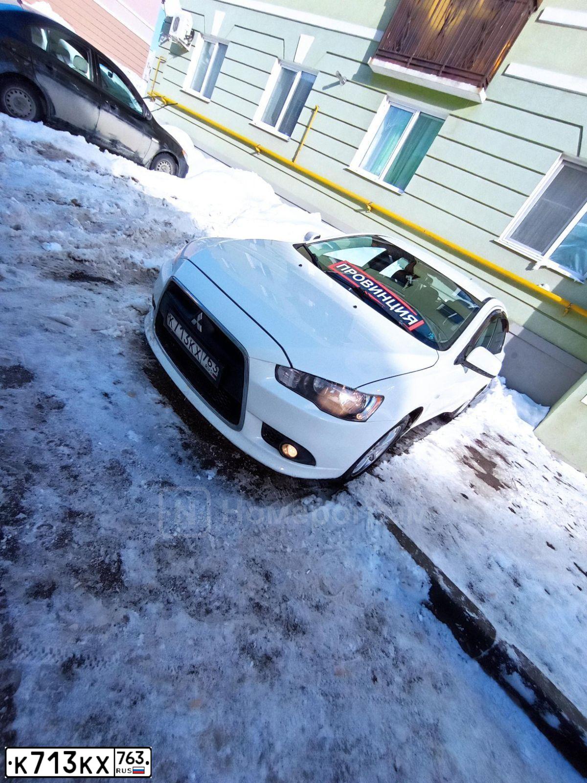 Фото автомобиля MITSUBISHI LANCER, 2011 — госномер Е500ХА63. Цвет: Белый