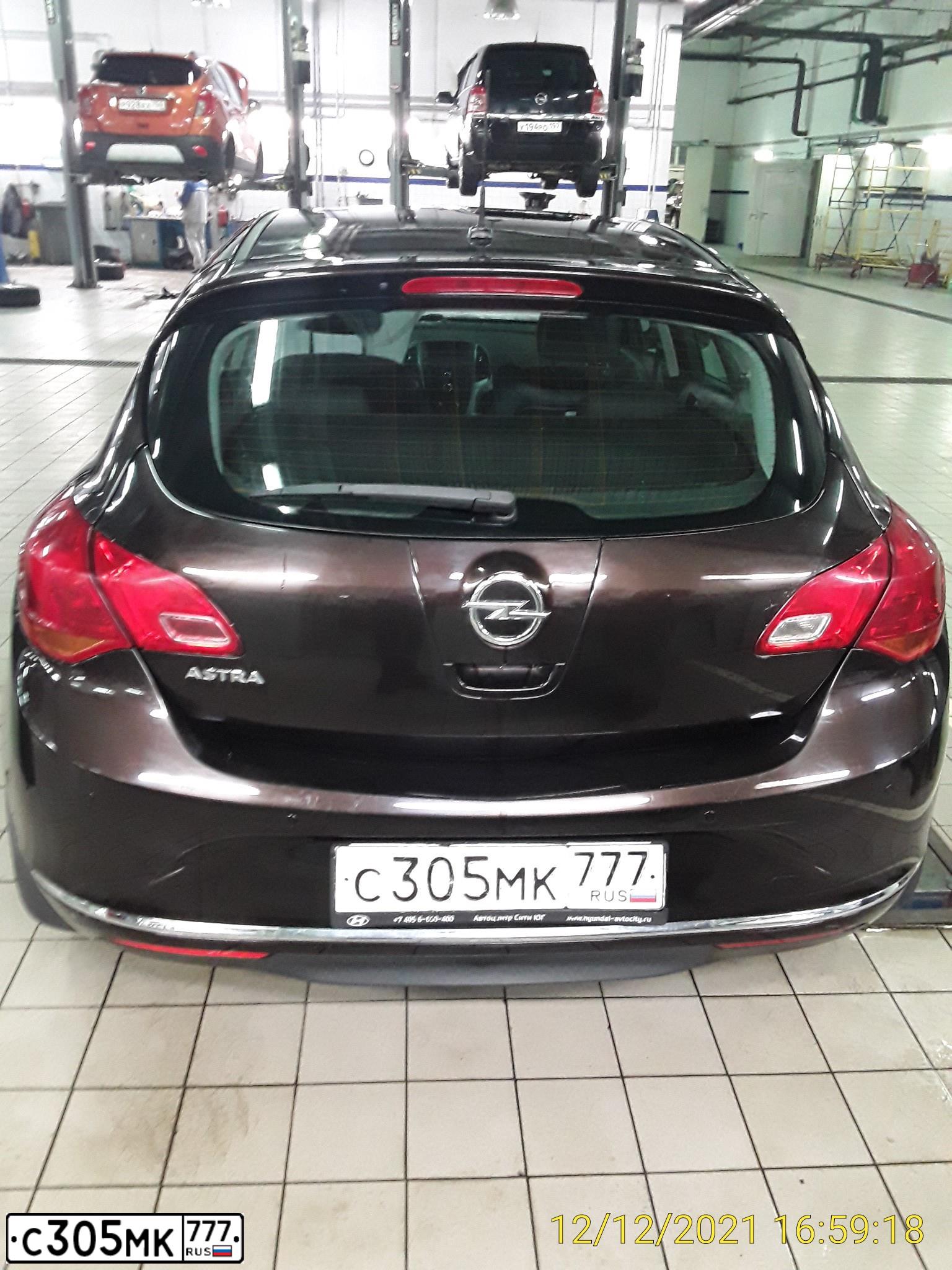 Фото автомобиля OPEL ASTRA, 2014 — госномер С305МК777. Цвет: КОРИЧНЕВЫЙ