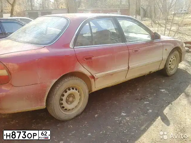 Фото автомобиля HYUNDAI SONATA, 1997 — госномер Н873ОР62. Цвет: КРАСНЫЙ (ВИШНЕВЫЙ)