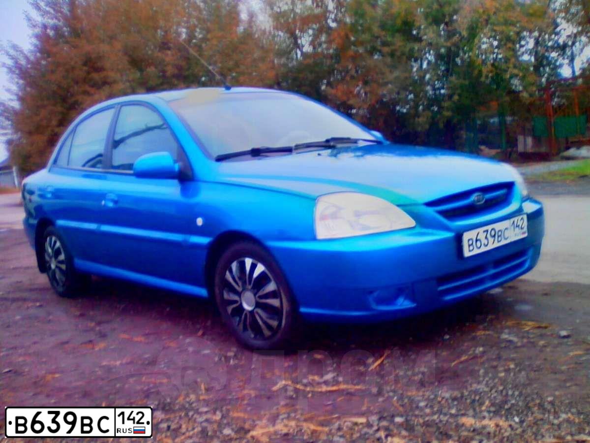 Фото автомобиля KIA RIO, 2004 — госномер К034ХО70. Цвет: СИНИЙ