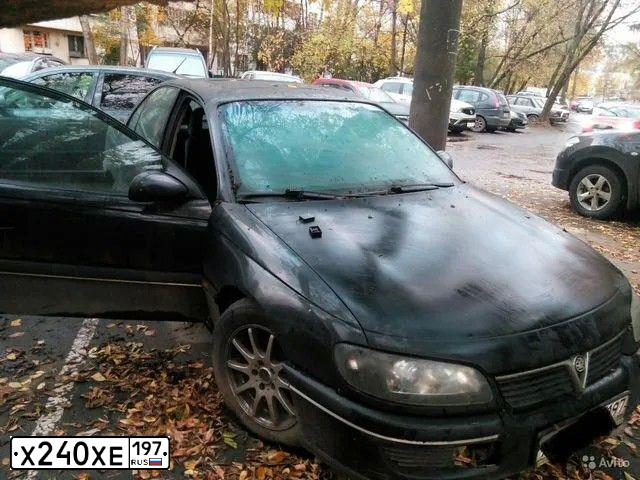 Фото автомобиля OPEL OMEGA, 1997 — госномер Х240ХЕ197. Цвет: ЧЕРНЫЙ