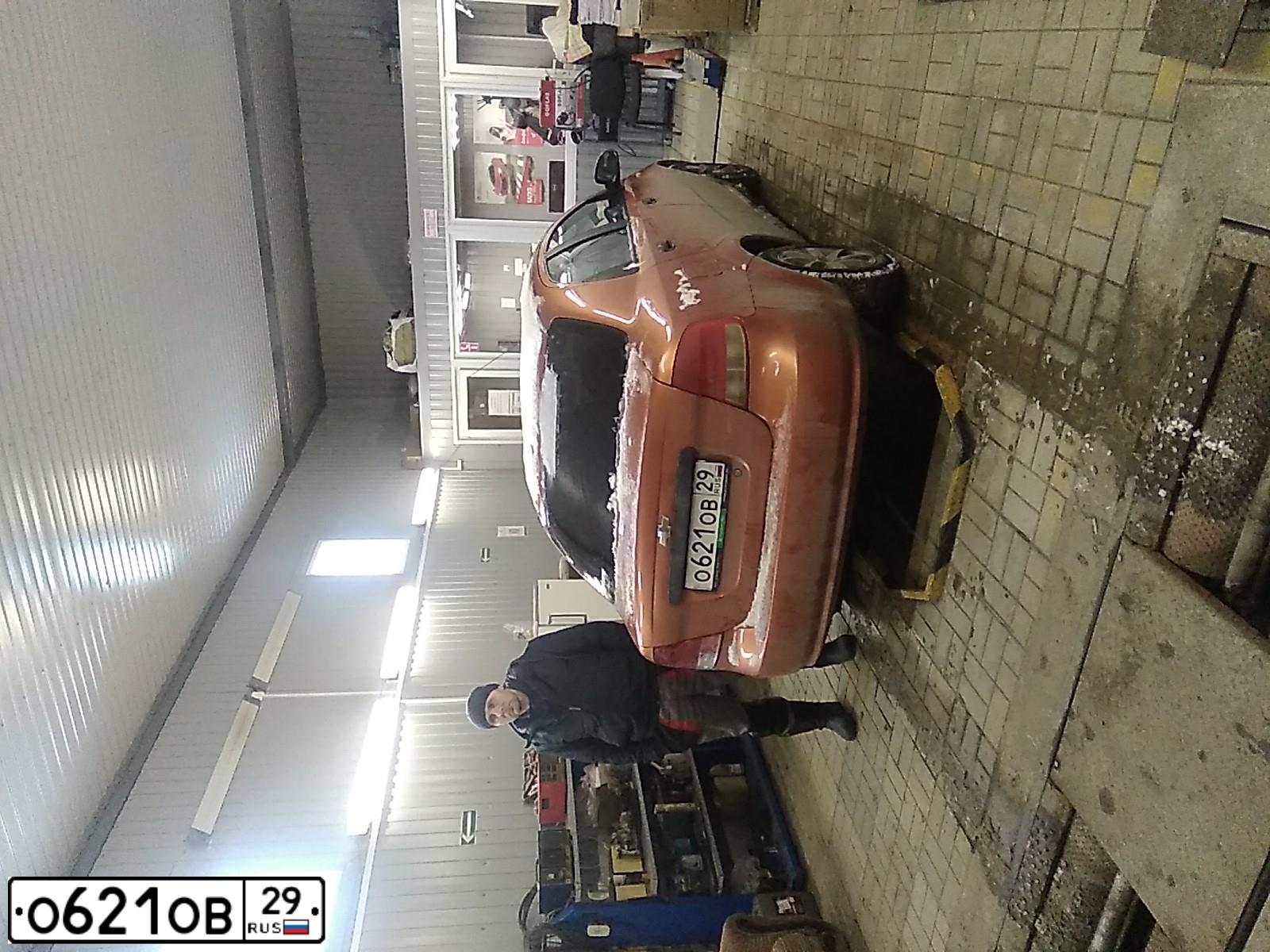 Фото автомобиля CHEVROLET AVEO, 2005 — госномер М316КМ35. Цвет: ОРАНЖЕВЫЙ