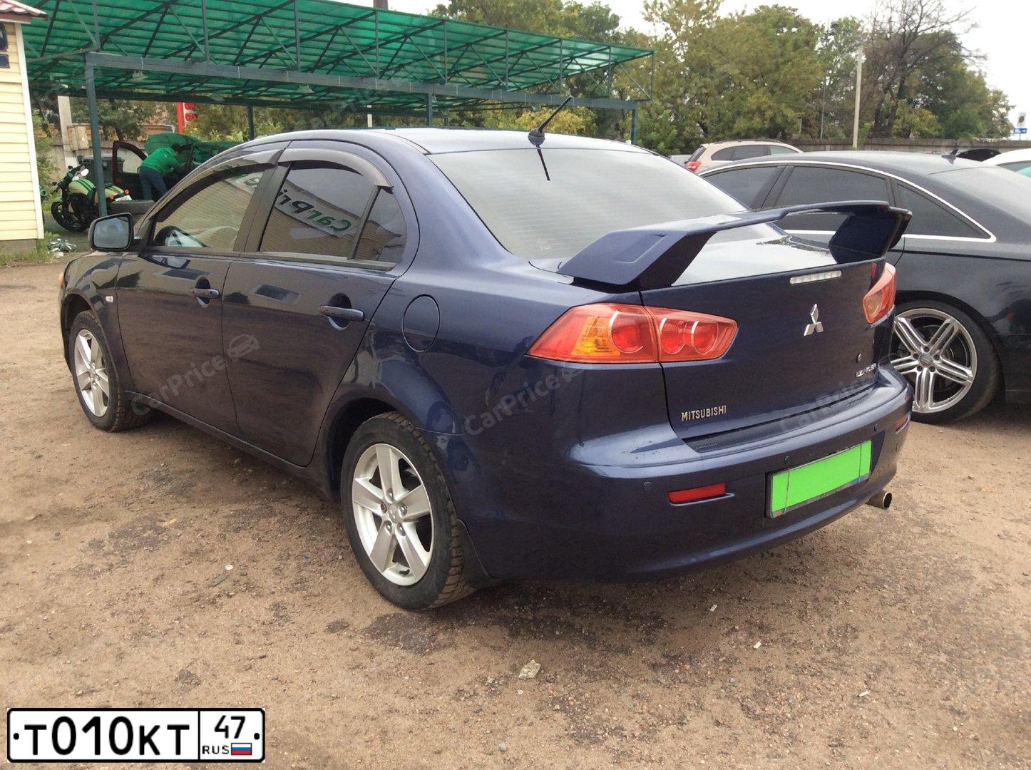 Фото автомобиля MITSUBISHI LANCER, 2008 — госномер Т010КТ47. Цвет: СИНИЙ