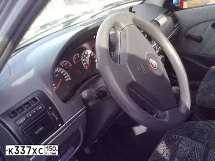 Фото автомобиля FIAT ALBEA, 2009 — госномер К337ХС150. Цвет: СЕРЫЙ