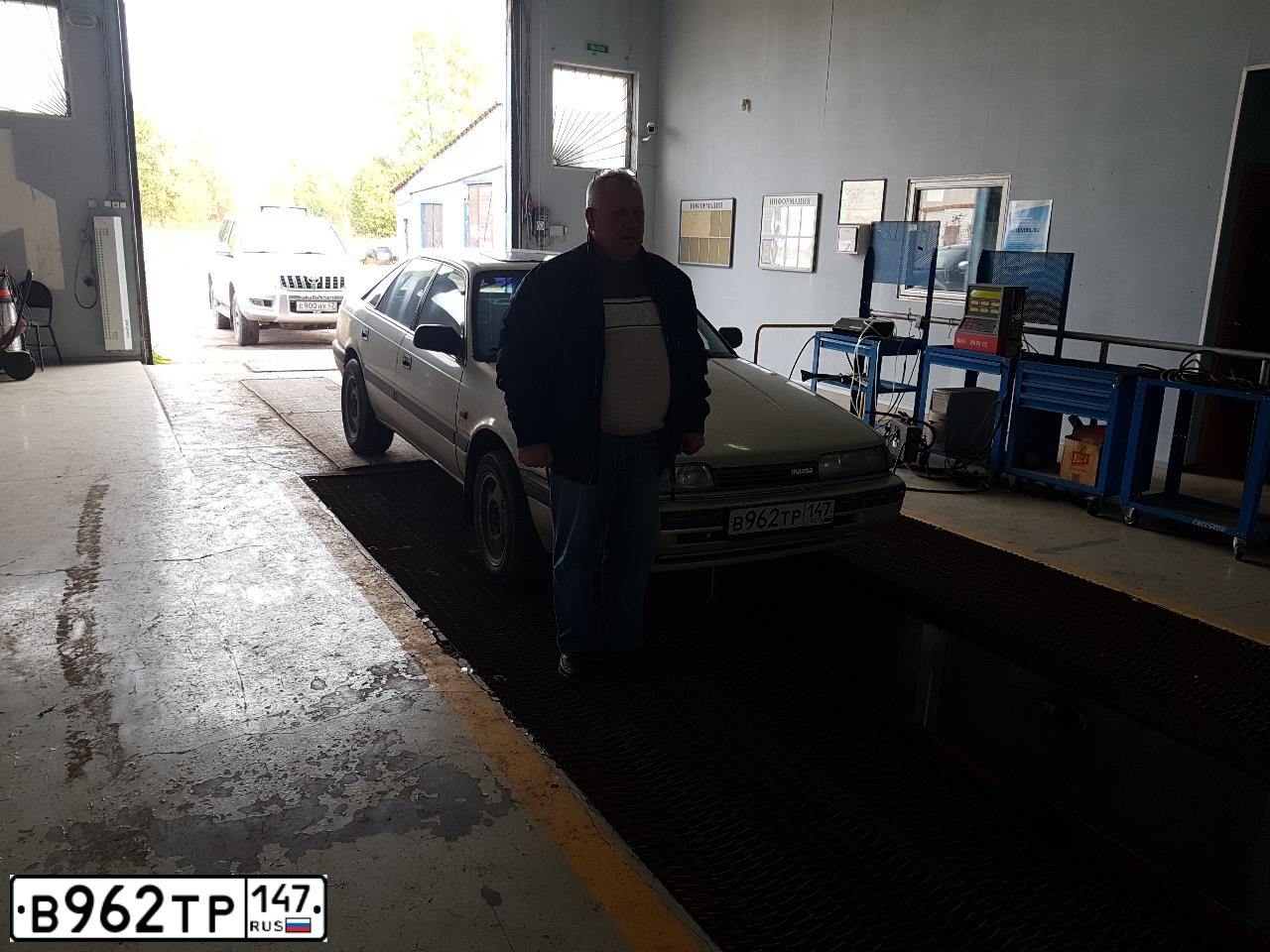 Фото автомобиля MAZDA 626, 1992 — госномер В141МО147. Цвет: Серый