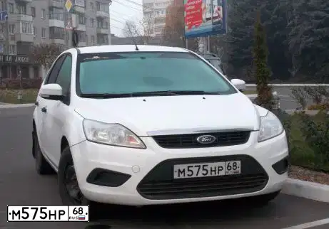 Фото автомобиля FORD FOCUS, 2010 — госномер М575НР68. Цвет: БЕЛЫЙ