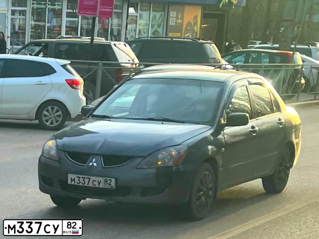 Фото автомобиля MITSUBISHI LANCER, 2003 — госномер М337СУ82. Цвет: темно-серый