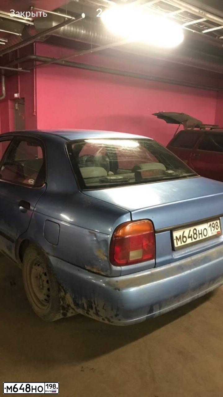 Фото автомобиля SUZUKI BALENO, 1999 — госномер К362НЕ98. Цвет: голубой