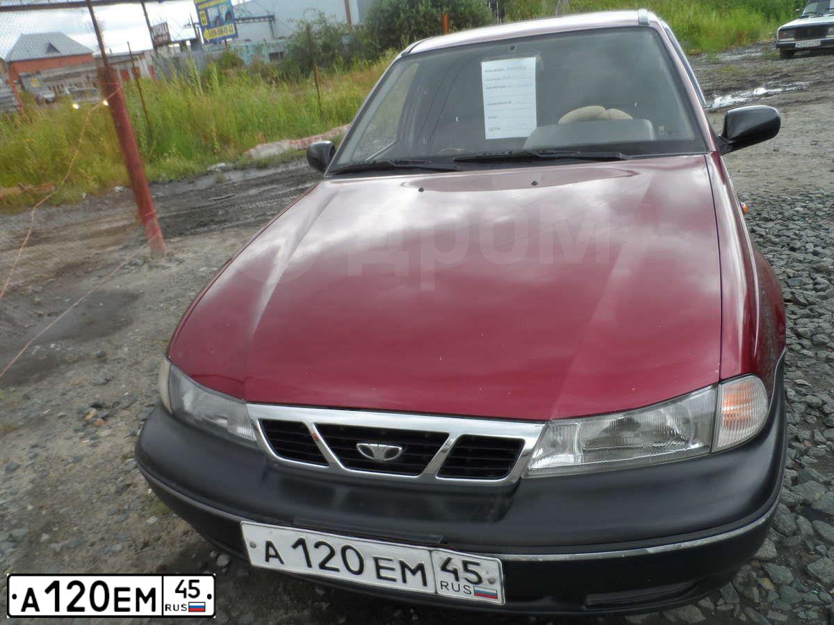 Фото автомобиля DAEWOO NEXIA, 2007 — госномер А120ЕМ45. Цвет: ВИШНЕВЫЙ