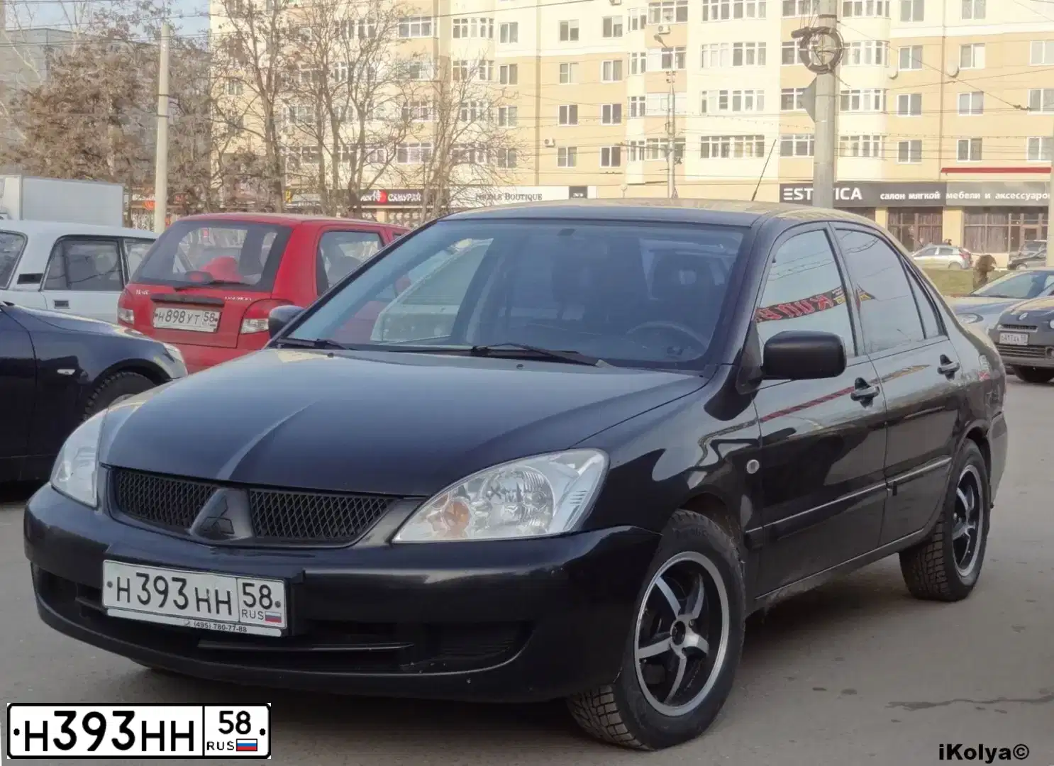 Фото автомобиля MITSUBISHI  LANCER 1.6, 2006 — госномер Н393НН58. Цвет: ЧЕРНЫЙ