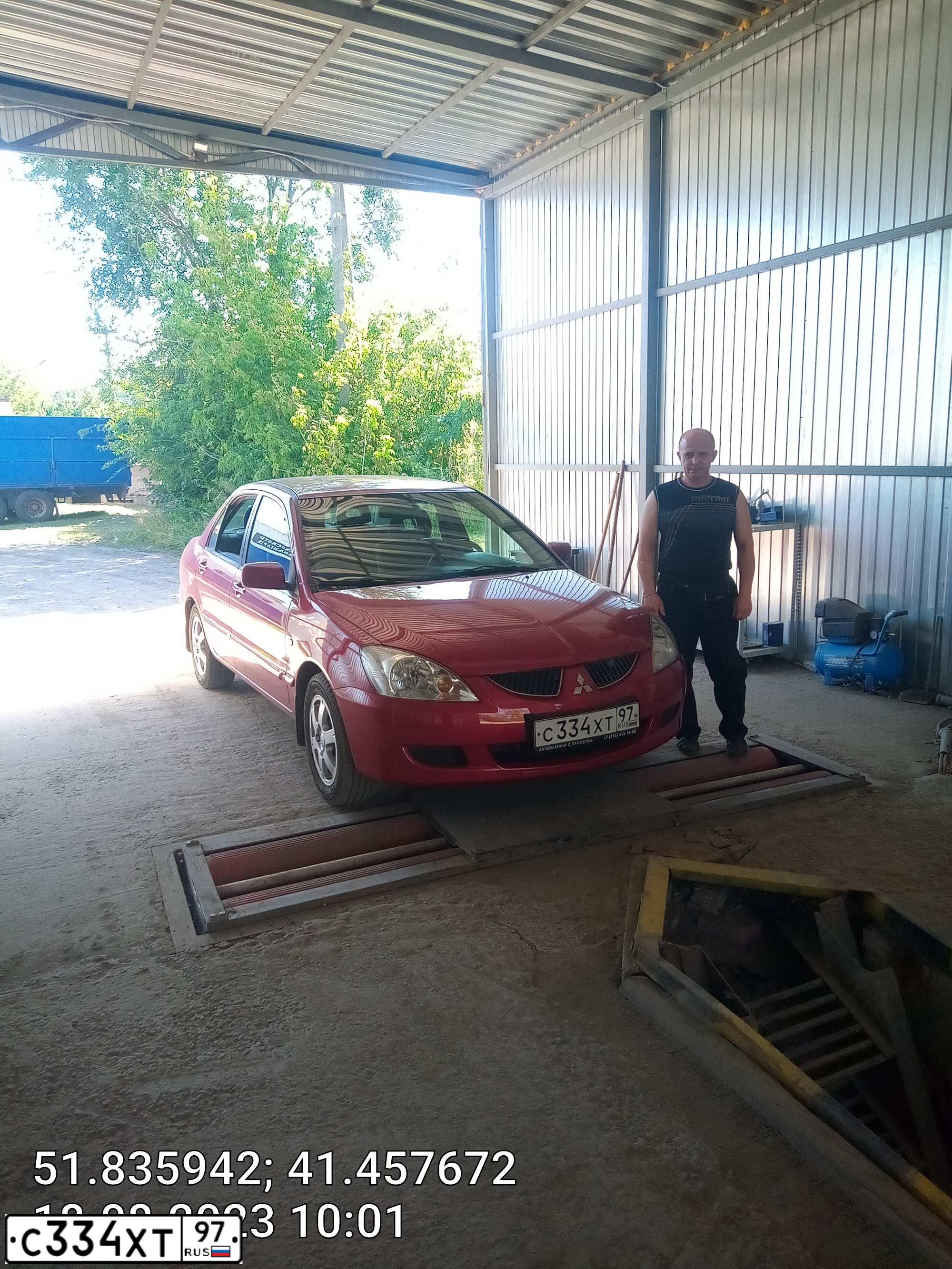Фото автомобиля MITSUBISHI LANCER, 2005 — госномер С334ХТ97. Цвет: Красный
