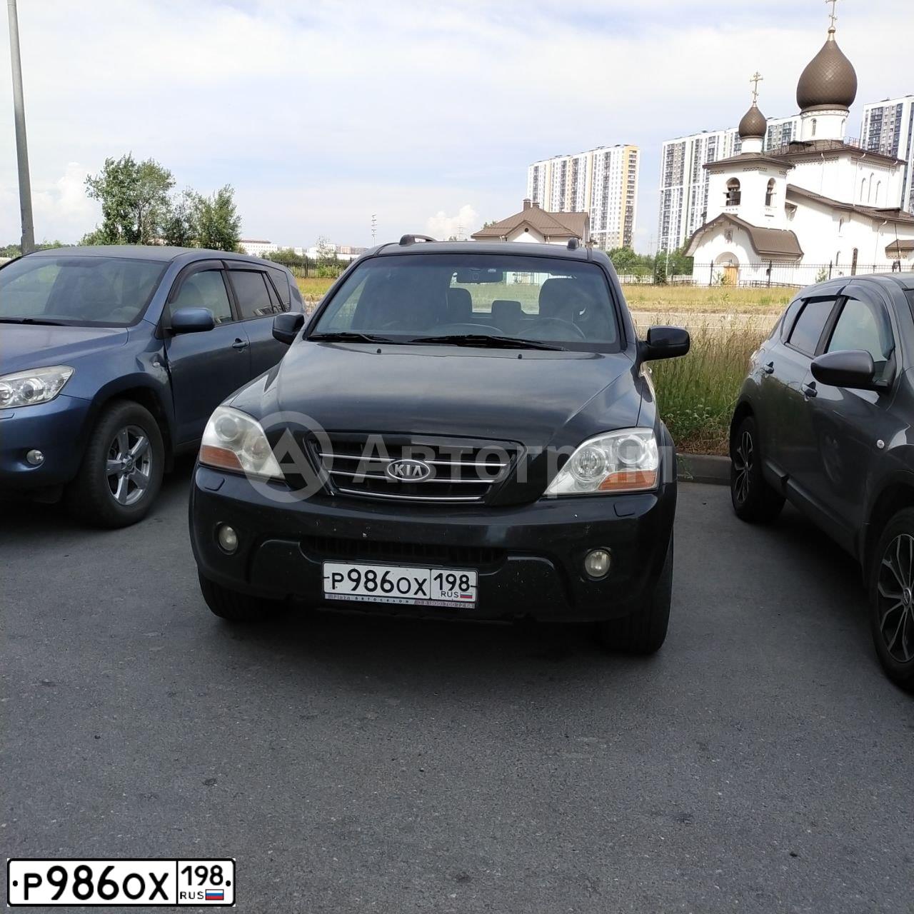 Фото автомобиля KIA SORENTO, 2008 — госномер Р986ОХ198. Цвет: ЧЕРНЫЙ