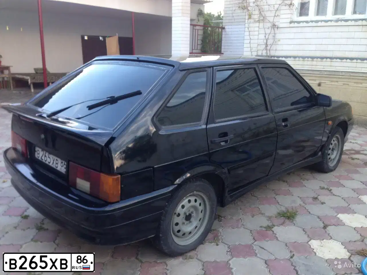 Фото автомобиля LADA 2114 SAMARA, 2009 — госномер М979ЕС186. Цвет: Темно-зеленый
