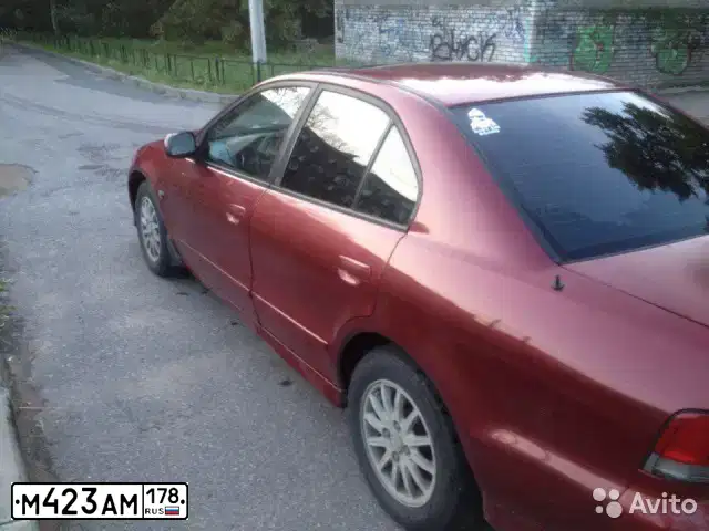 Фото автомобиля MITSUBISHI GALANT, 1998 — госномер М423АМ178. Цвет: ТЕМНО-КРАСНЫЙ
