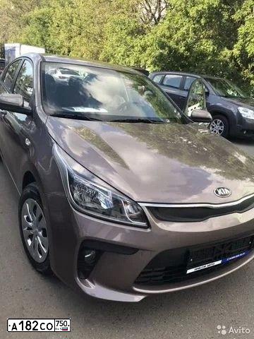 Фото автомобиля KIA RIO, 2018 — госномер А182СО750. Цвет: СВЕТЛО-КОРИЧНЕВЫЙ