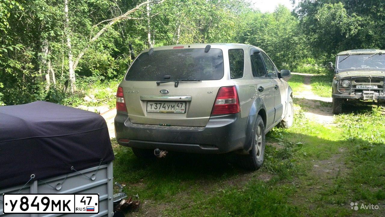 Фото автомобиля KIA SPORTAGE, 2006 — госномер Е306ЕМ147. Цвет: Коричневый
