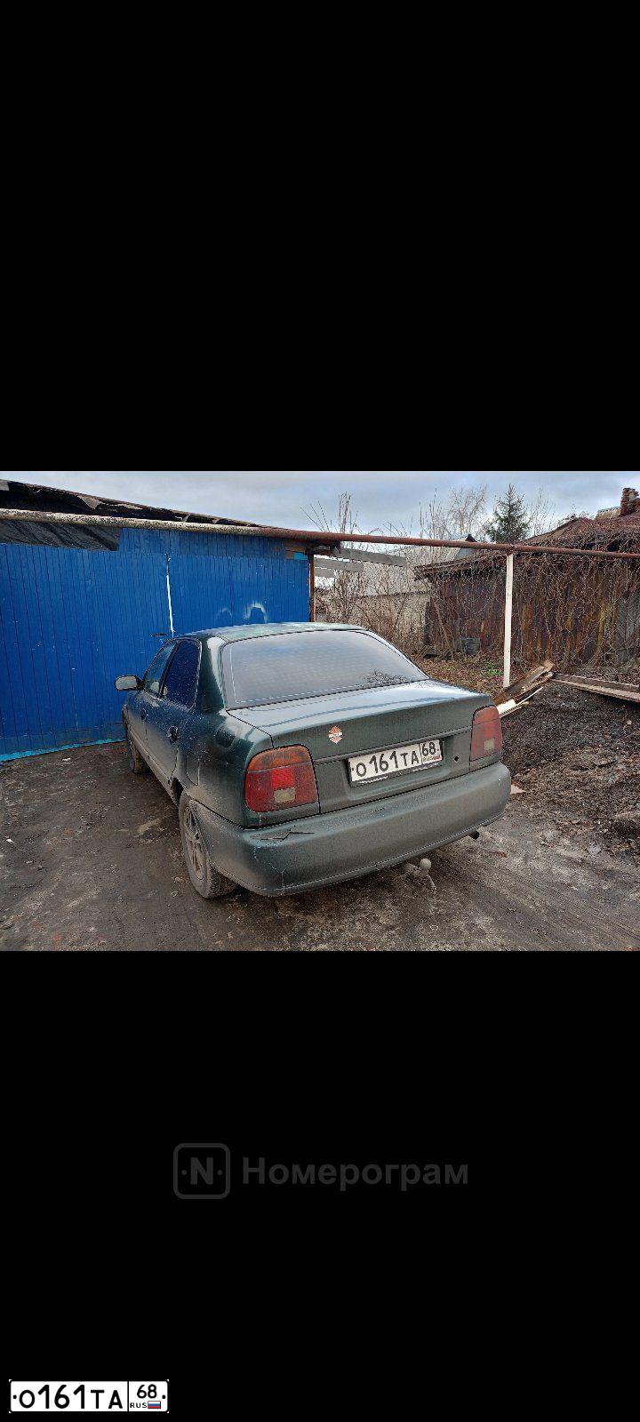 Фото автомобиля SUZUKI BALENO, 1999 — госномер М468ЕМ68. Цвет: ЗЕЛЕНЫЙ