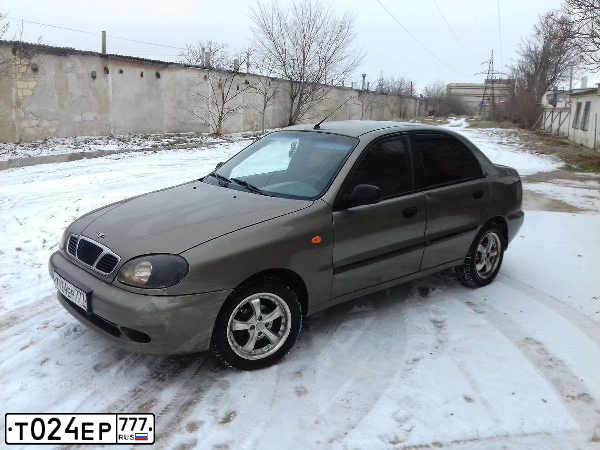 Фото автомобиля ДЭУ LANOS D4LМ500, 2003 — госномер Е941КТ82. Цвет: ЗЕЛЕНЫЙ