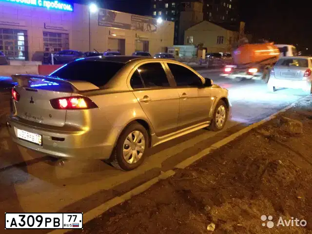 Фото автомобиля MITSUBISHI LANCER, 2008 — госномер Е931РК123. Цвет: БЕЖЕВЫЙ