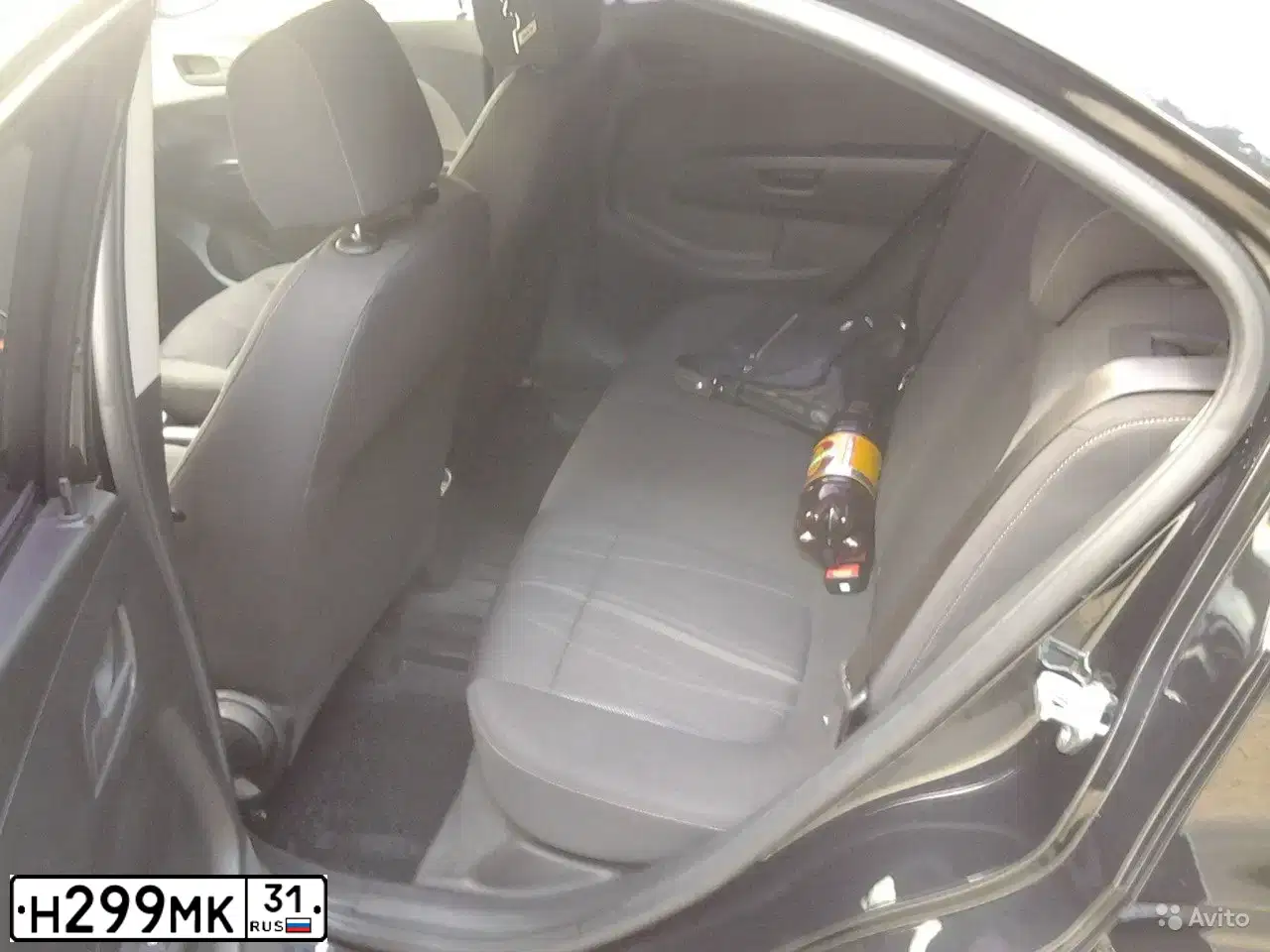 Фото автомобиля CHEVROLET AVEO, 2013 — госномер Н299МК31. Цвет: ЧЕРНЫЙ