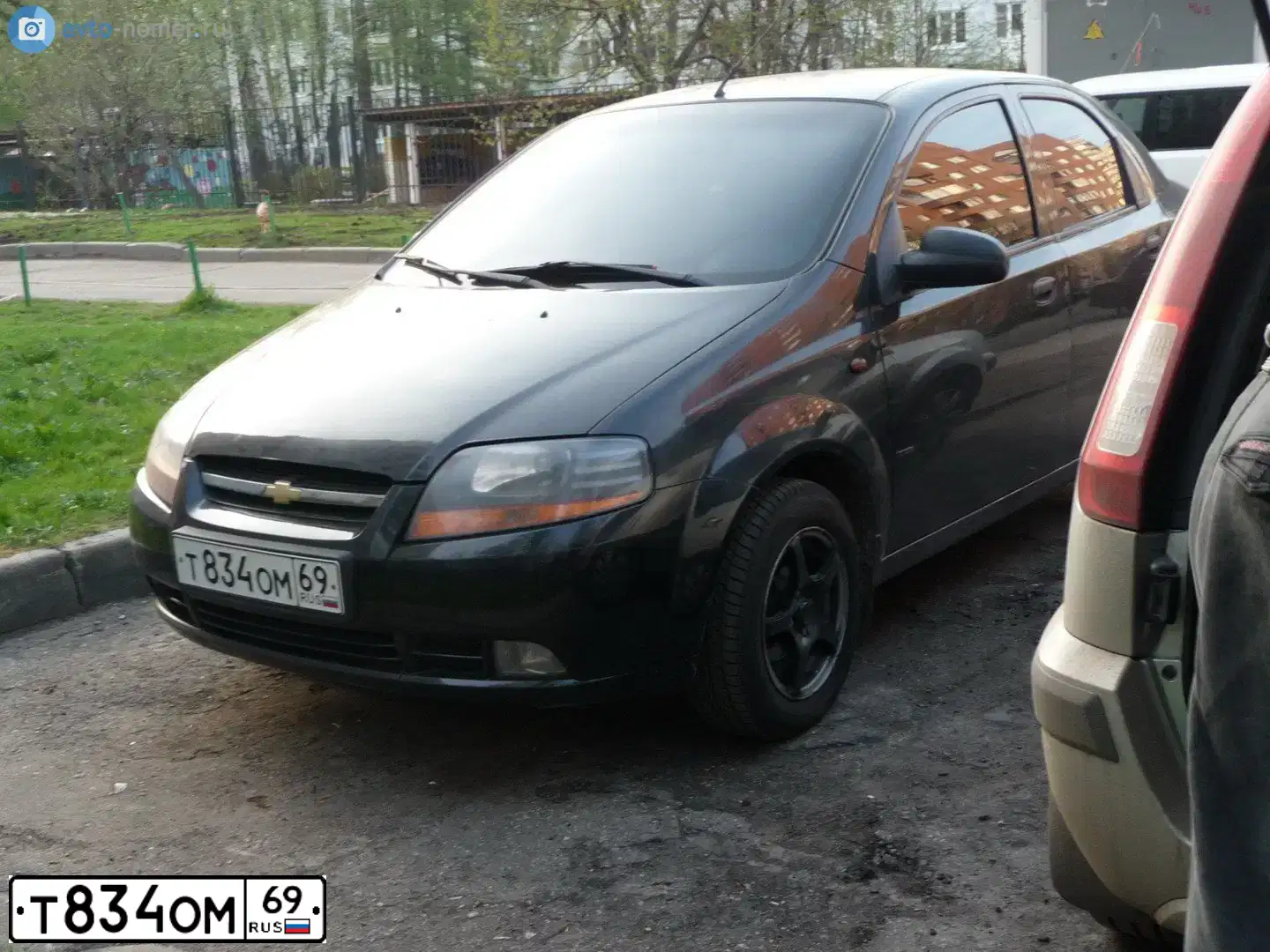 Фото автомобиля CHEVROLET AVEO, 2005 — госномер Т834ОМ69. Цвет: ЧЕРНЫЙ