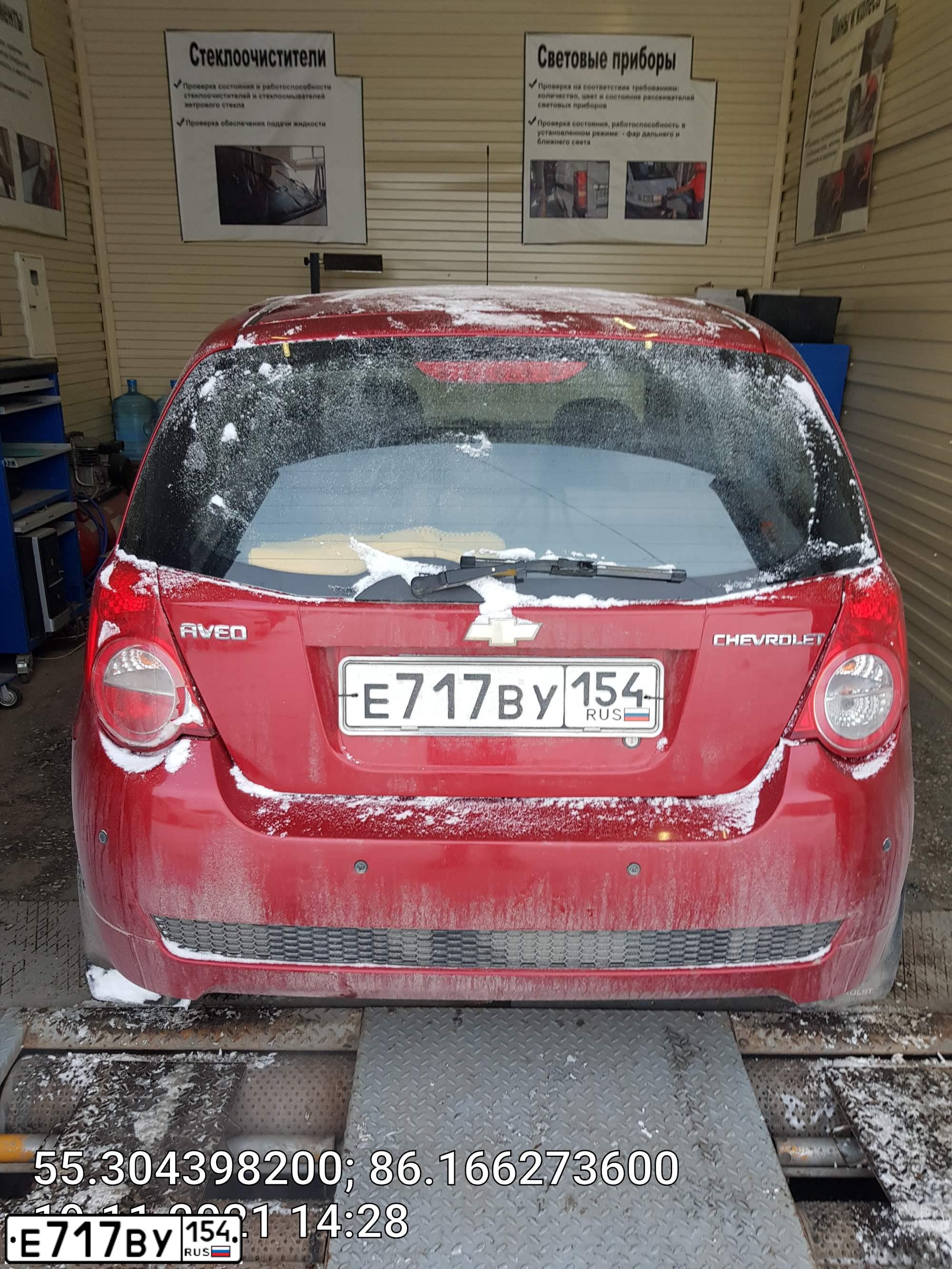 Фото автомобиля CHEVROLET AVEO, 2008 — госномер Е717ВУ154. Цвет: ТЕМНО КРАСНЫЙ