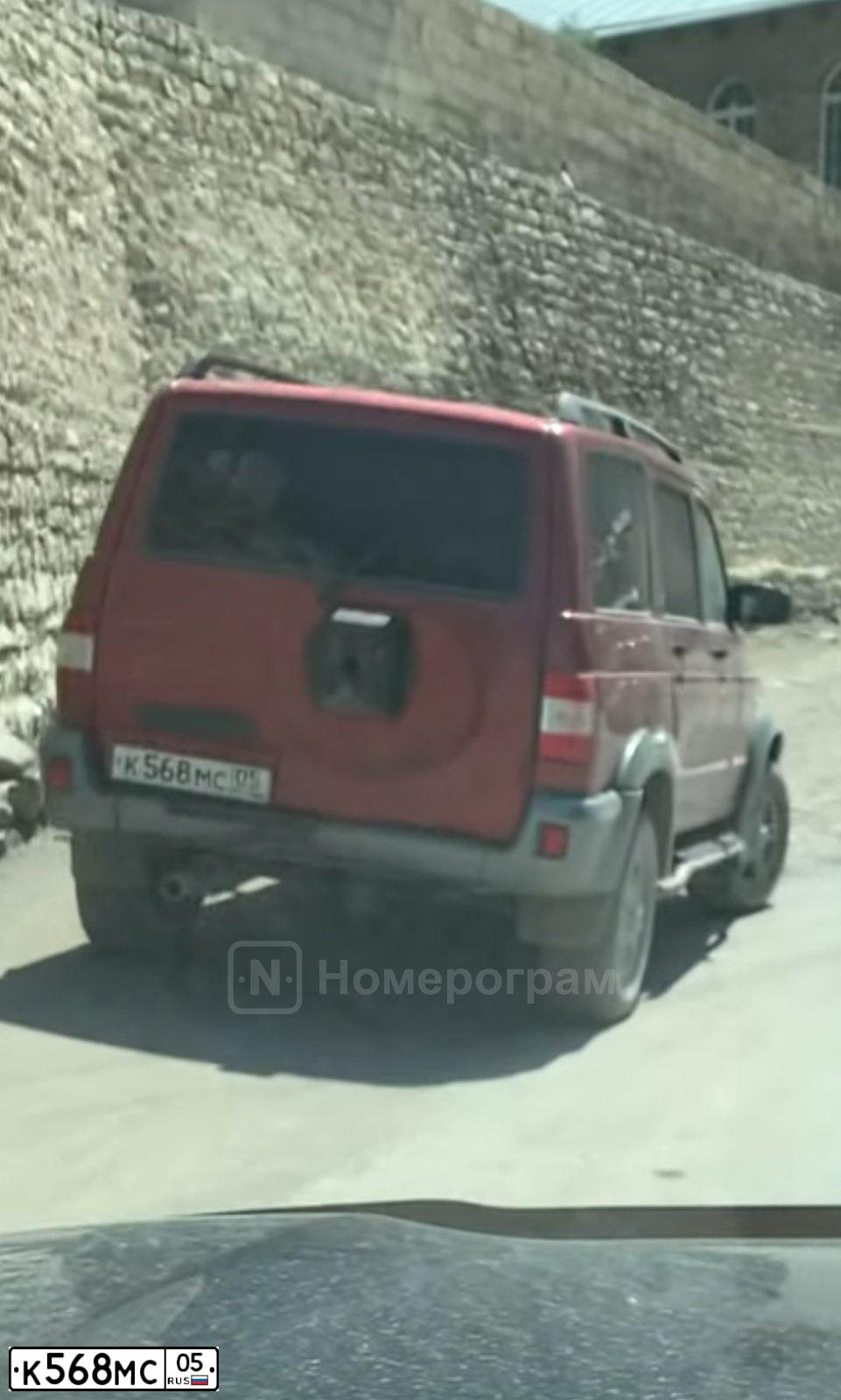 Фото автомобиля UAZ 3163 PATRIOT, 2009 — госномер К568МС05. Цвет: МАЛИНА МЕТАЛЛИК