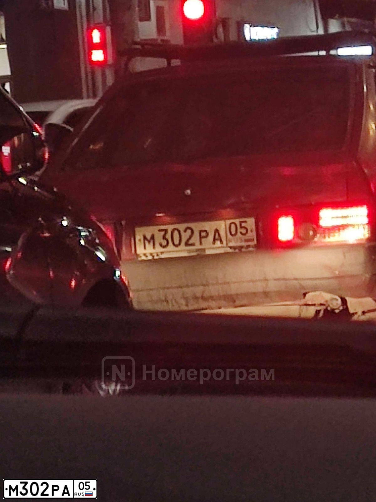 Фото автомобиля LADA 2109 SAMARA, 1992 — госномер М302РА05. Цвет: КРАСНЫЙ