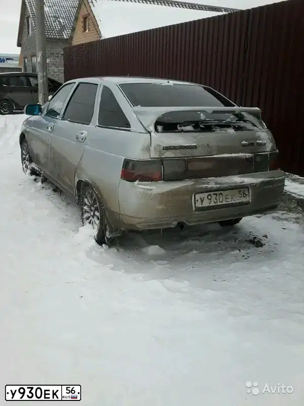 Фото автомобиля LADA 2112, 2005 — госномер Е350КВ156. Цвет: Серебристо-желто-голубой