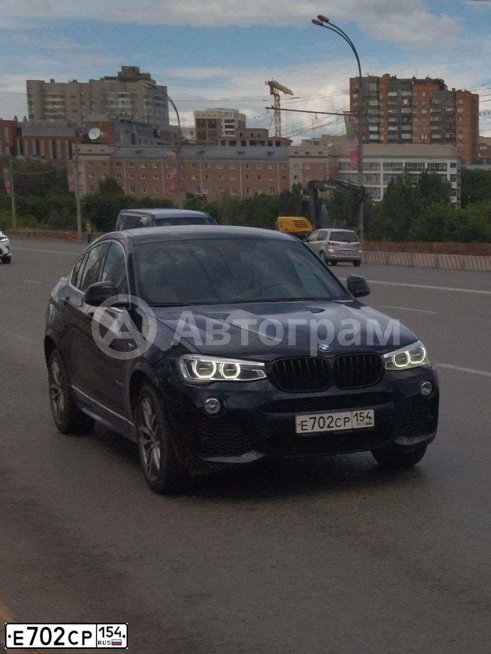 Фото автомобиля BMW X4, 2016 — госномер Е702СР154. Цвет: ЧЕРНЫЙ