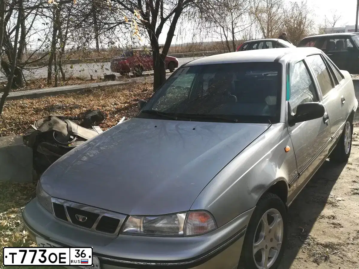 Фото автомобиля DAEWOO NEXIA, 2008 — госномер Т773ОЕ36. Цвет: СЕРЕБРИСТЫЙ