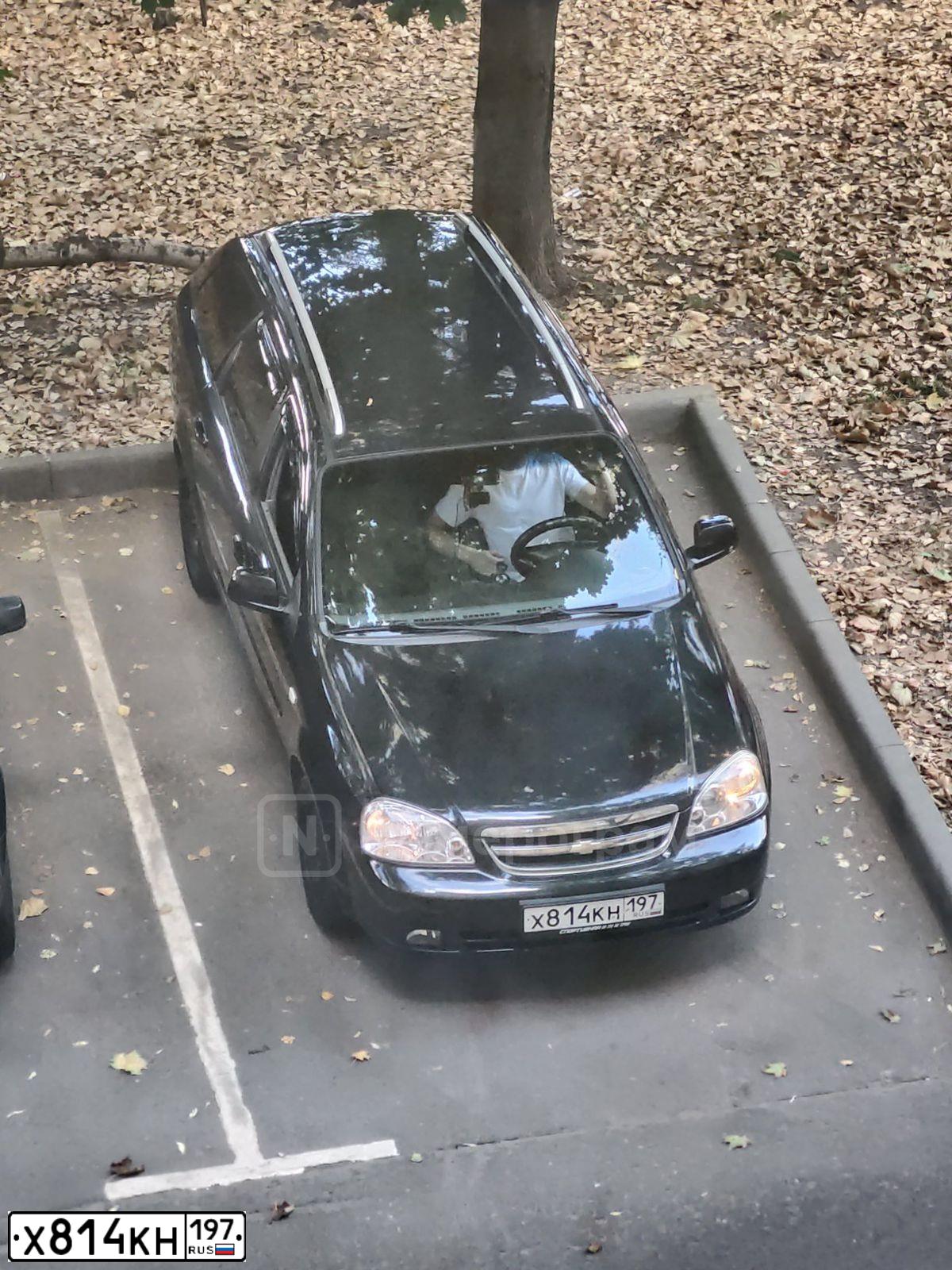Фото автомобиля CHEVROLET LACETTI, 2010 — госномер Х814КН197. Цвет: ЧЕРНЫЙ