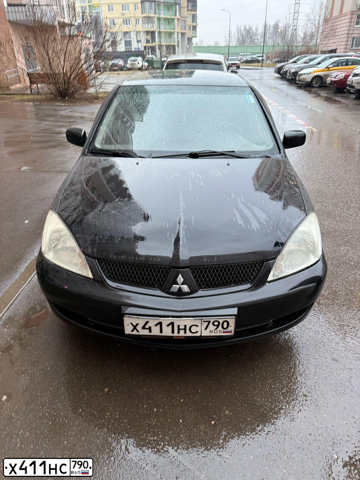Фото автомобиля MITSUBISHI LANCER, 2005 — госномер М970ХТ33. Цвет: ЧЕРНЫЙ