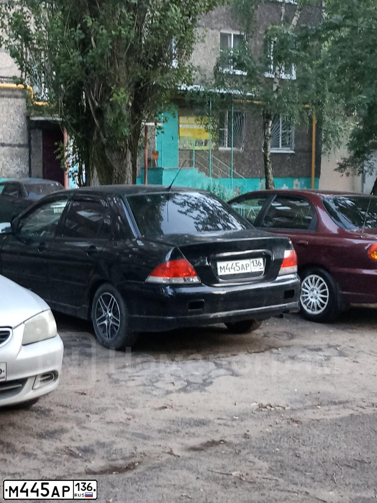 Фото автомобиля MITSUBISHI LANCER, 2006 — госномер Е367ОВ136. Цвет: ЧЕРНЫЙ