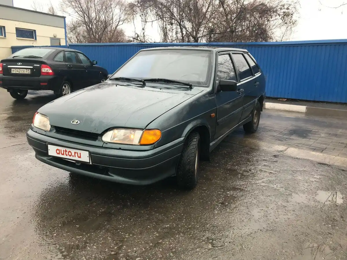 Фото автомобиля LADA 2172 PRIORA, 2009 — госномер Р042СЕ31. Цвет: Сине-Черный