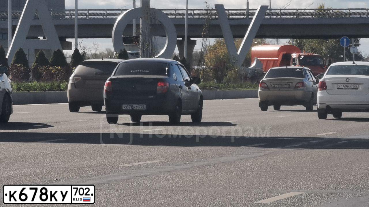 Фото автомобиля LADA 2190 GRANTA, 2013 — госномер К678КУ702. Цвет: Сине-Черный