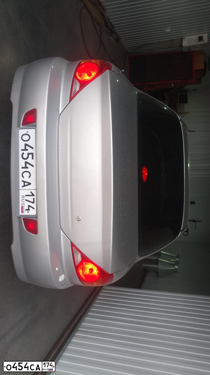 Фото автомобиля KIA SPECTRA, 2007 — госномер О454СА174. Цвет: АЛМАЗНОЕ СЕРЕБРО