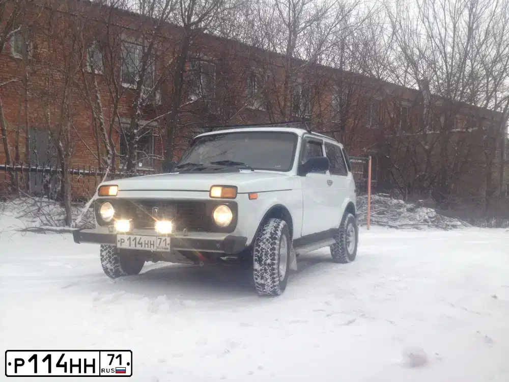Фото автомобиля LADA 2121 NIVA, 1997 — госномер Р114НН71. Цвет: БЕЛЫЙ