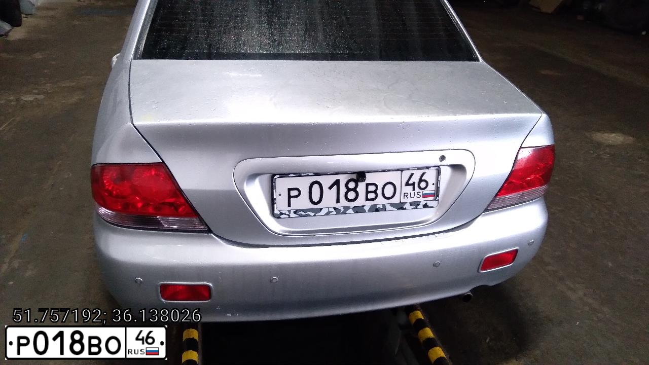 Фото автомобиля MITSUBISHI LANCER, 2004 — госномер Р018ВО46. Цвет: Серебристый
