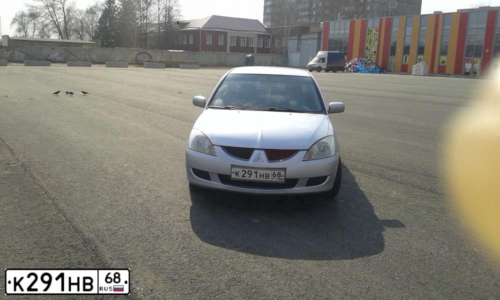 Фото автомобиля MITSUBISHI LANCER, 2004 — госномер Р425МО68. Цвет: Серебристый
