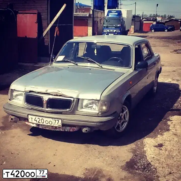Фото автомобиля GAZ 3110 WOLGA, 1998 — госномер Т420ОО77. Цвет: СЕРЫЙ