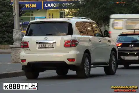 Фото автомобиля NISSAN PATROL, 2014 — госномер Н157ЕО134. Цвет: БЕЛЫЙ