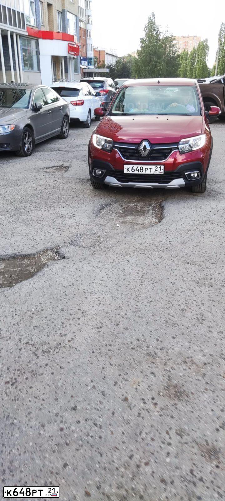Фото автомобиля RENAULT LOGAN, 2020 — госномер К648РТ21. Цвет: Красный
